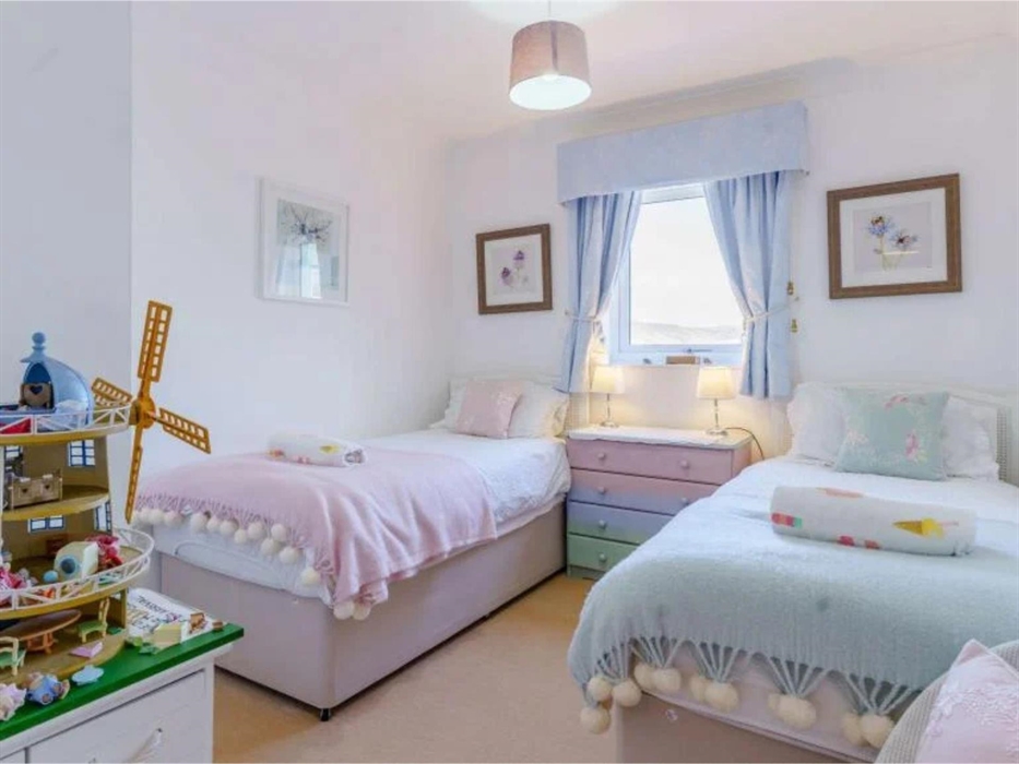 We made the twin room suitable for little people but pretty enough for older guests too!  It has kiddy surprises in the wardrobe, a chest of drawers a