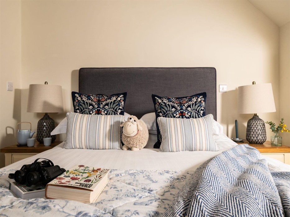 This cosy bedroom oozes country cottage and in keeping with its name 'shepherd's cottage' has its own sheep accessories