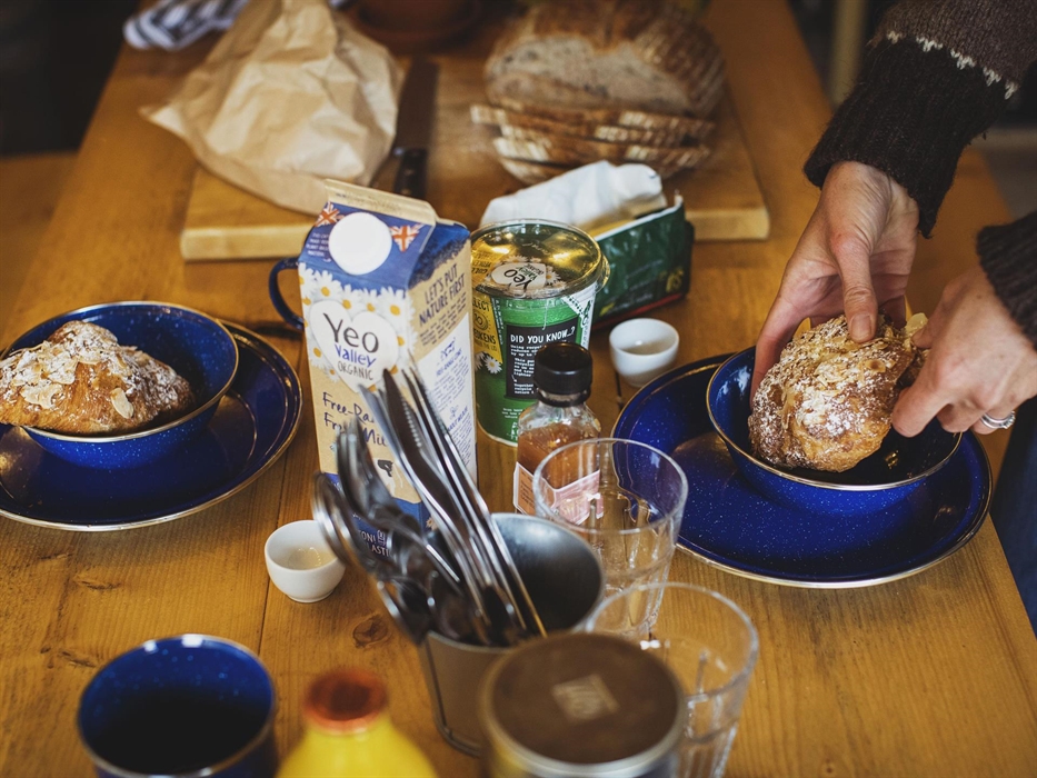 A close up of a dining table set for breakfast