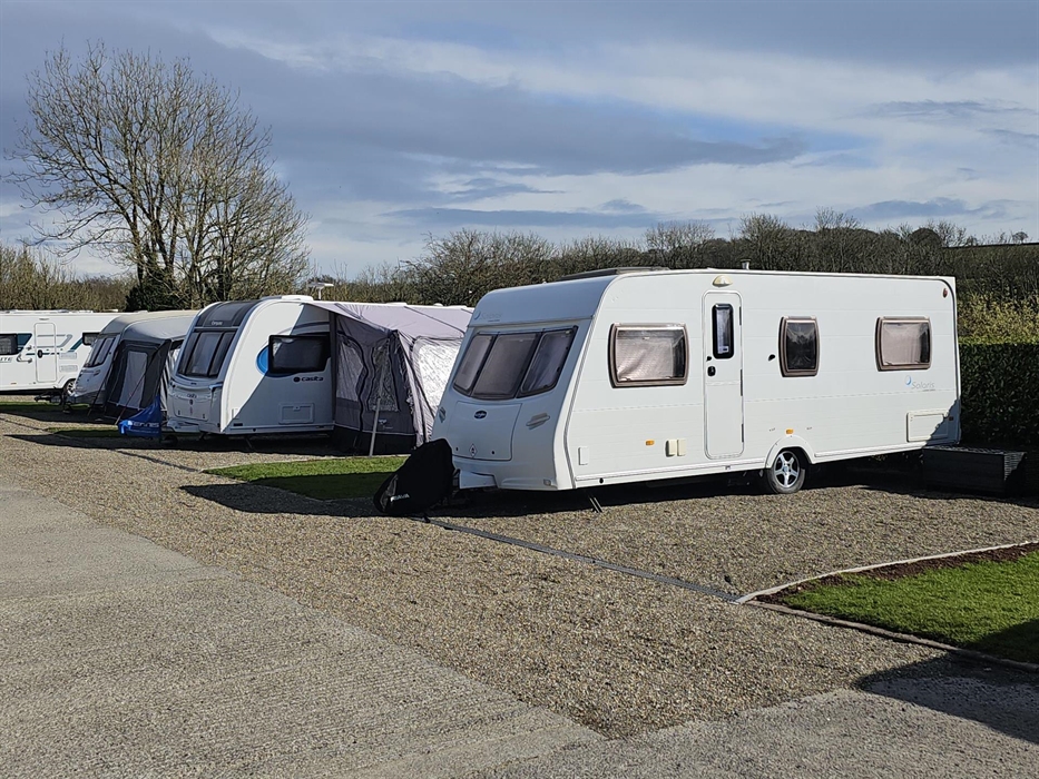 Touring field pitches, fully hard standing with small grass area to side.