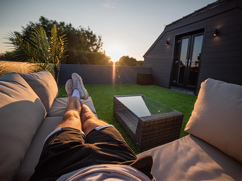 Ascend to the roof terrace, where comfortable sun loungers await, offering a sublime spot for sunbathing or stargazing as dusk settles.