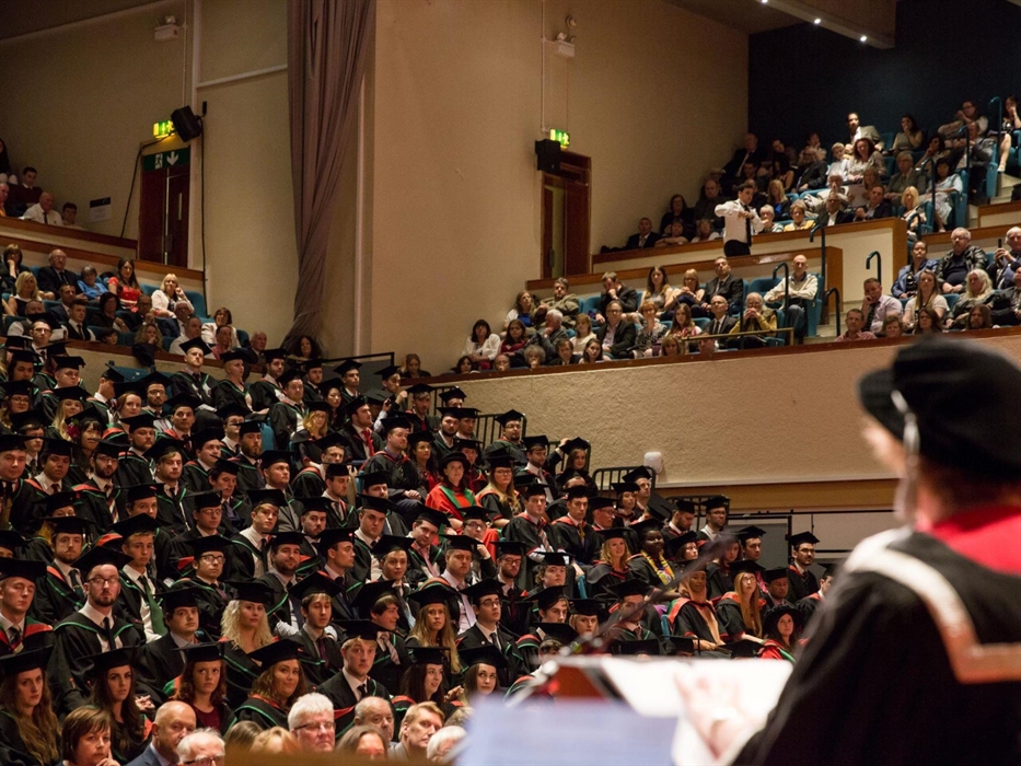 A busy audience at a graduation event