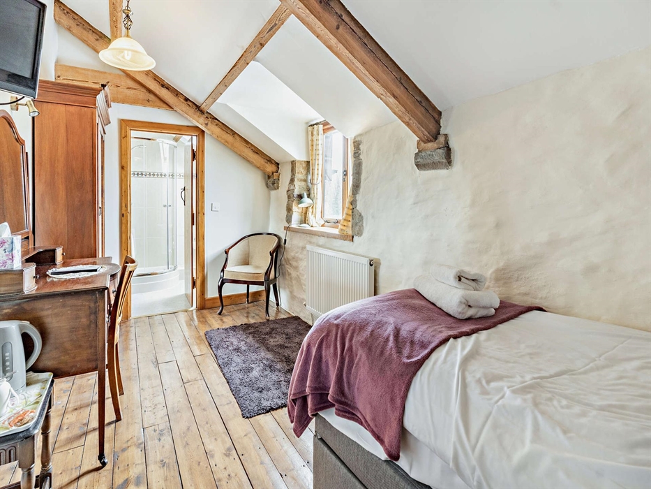 Room 5, sleeps 1 with a single bed & a shower en-suite