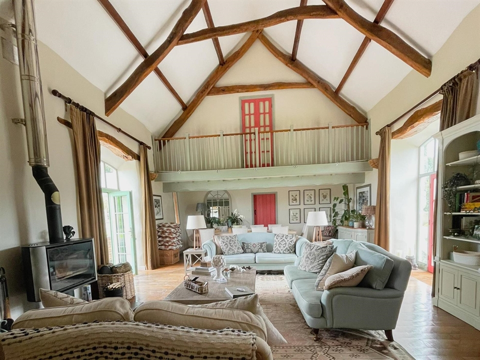 Open to the eaves the lounge at Ysgubor Degwm self catering holiday cottage by seadog and stone.  Converted barn that sleeps ten on the llyn peninsula