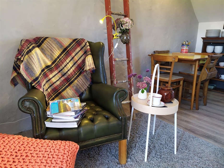 Haylofts living area with stylish vintage touches.