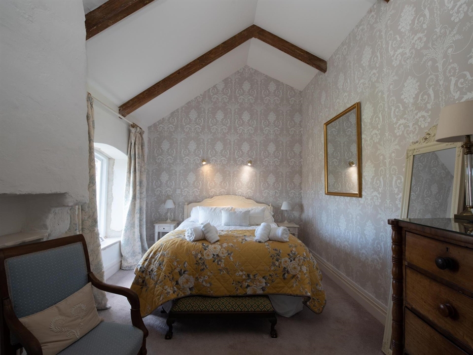 Luxurious bedroom with ensuite, and gorgeous views of inside the castle
