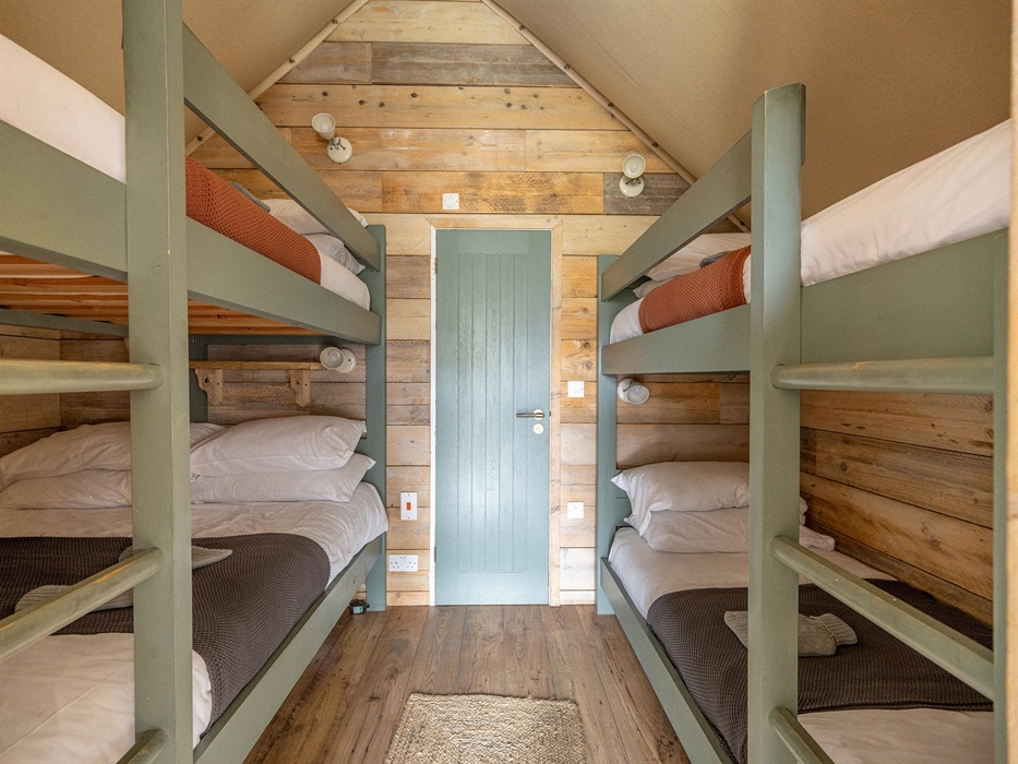 Each tent either has a king plus 2 or 3 single beds.