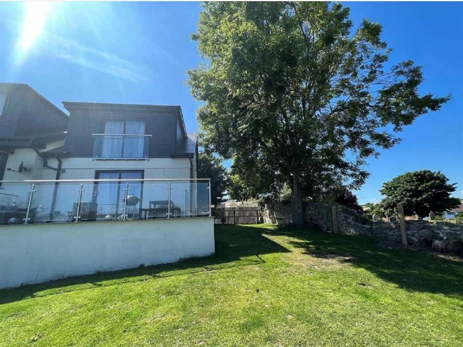 Private sun terrace and patio equipped with rattan furniture and BBQ and firepit for guests to enjoy the village views from our elevated position.