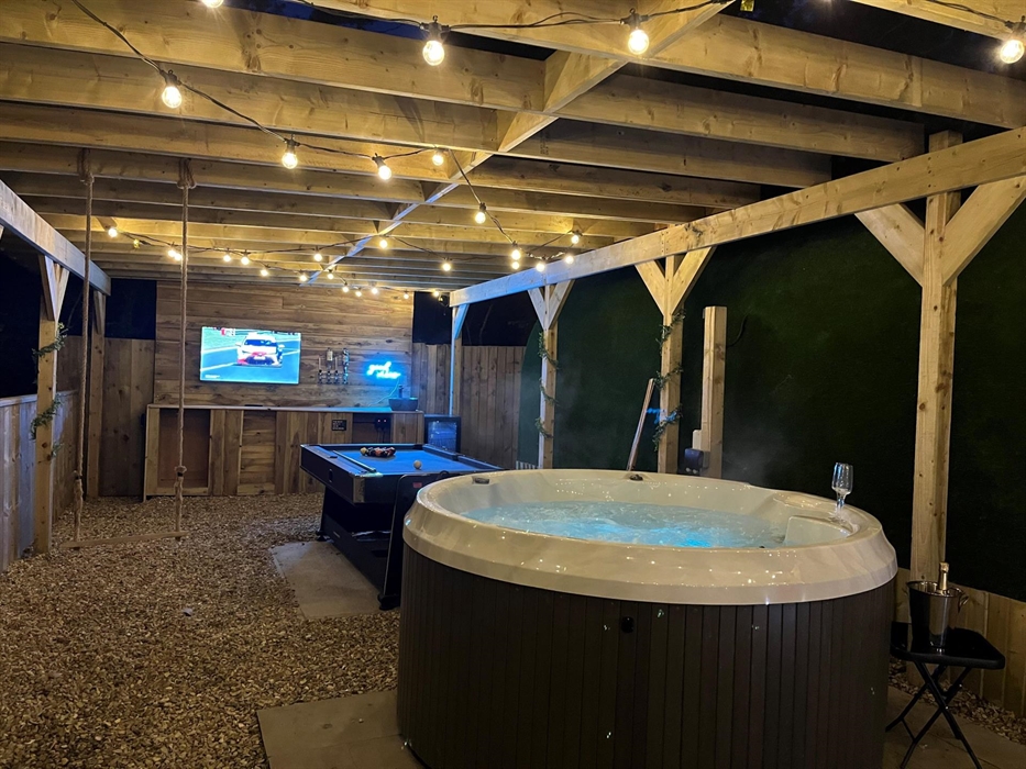 outside hot tub, and pool table