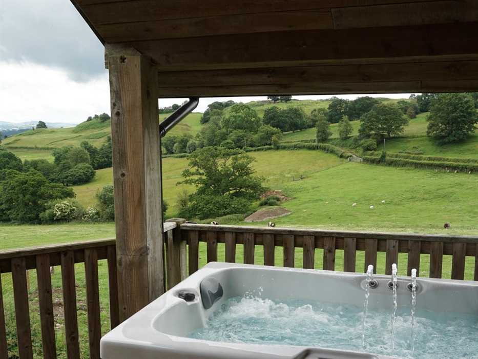 Private covered hot tub with amazing views across the farm and surrounding countryside.
