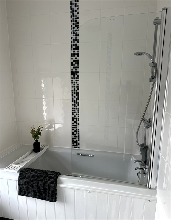 Family Bathroom contains wc, basin, toilet and shower over bath.