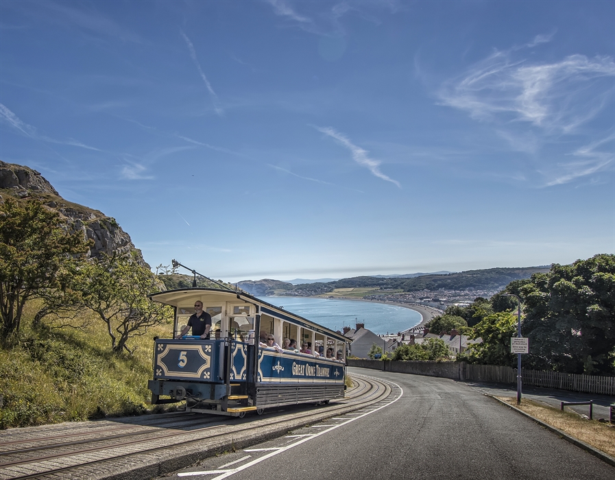 Great Orme Tramcar climbing up with view of Llandudno