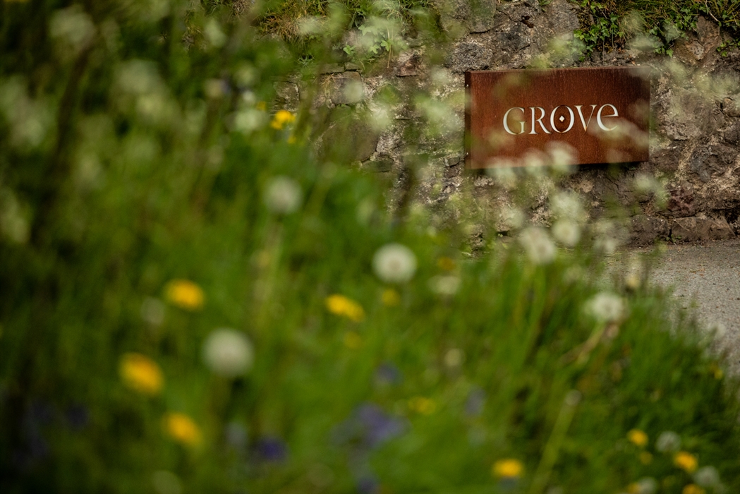 Hotel sign with flowers