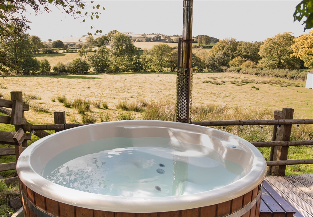 Hot tub with a perfect view over fields and countryside. Watch the sun set over the hills.