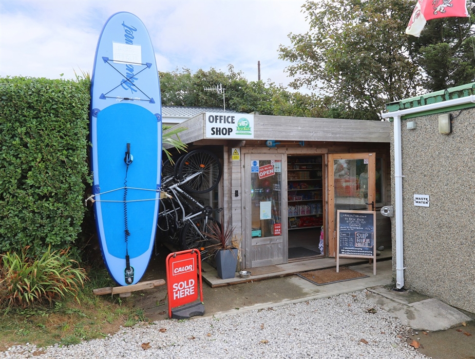On site shop selling local milk, eggs, bread, ice cream, bagged ice, confectionary, alcohol, cold drinks, food and beach goods. Bike & SUP hire