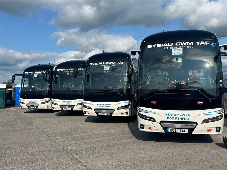 four coaches parked in a row