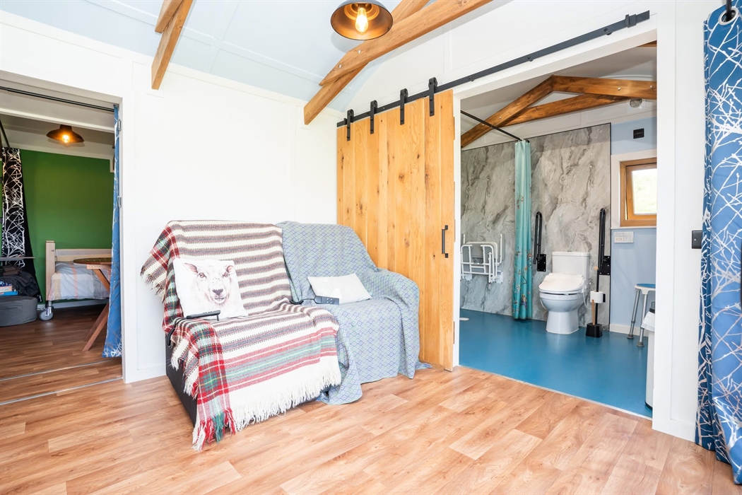 Standing by the sliding door looking in: slightly to your right are the 2 drop arms Arm chairs. Both at a push of a button will either recline you bac