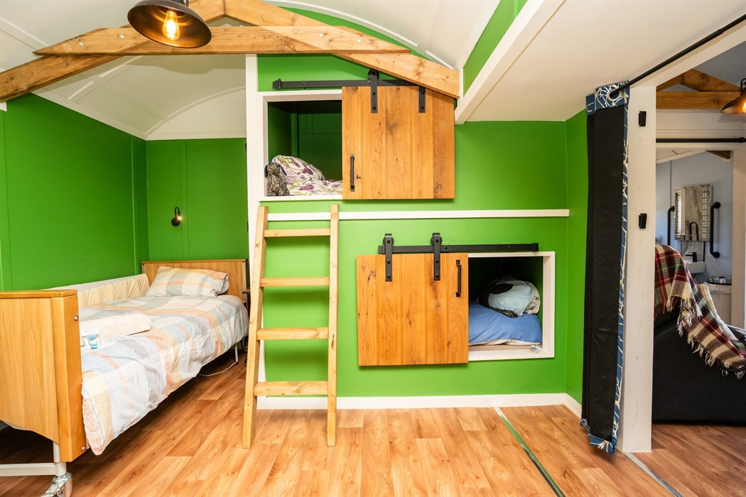 Sitting on the adjustable bed, looking into the room. You’ll see 2 holes in the wall, these are our sensory pods. Tardis like dens within the small ho