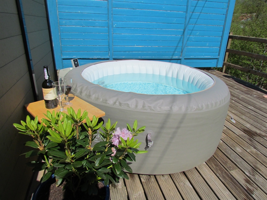 Relax and unwind in the hot tub while admiring the surrounding scenery or stars on a clear night.