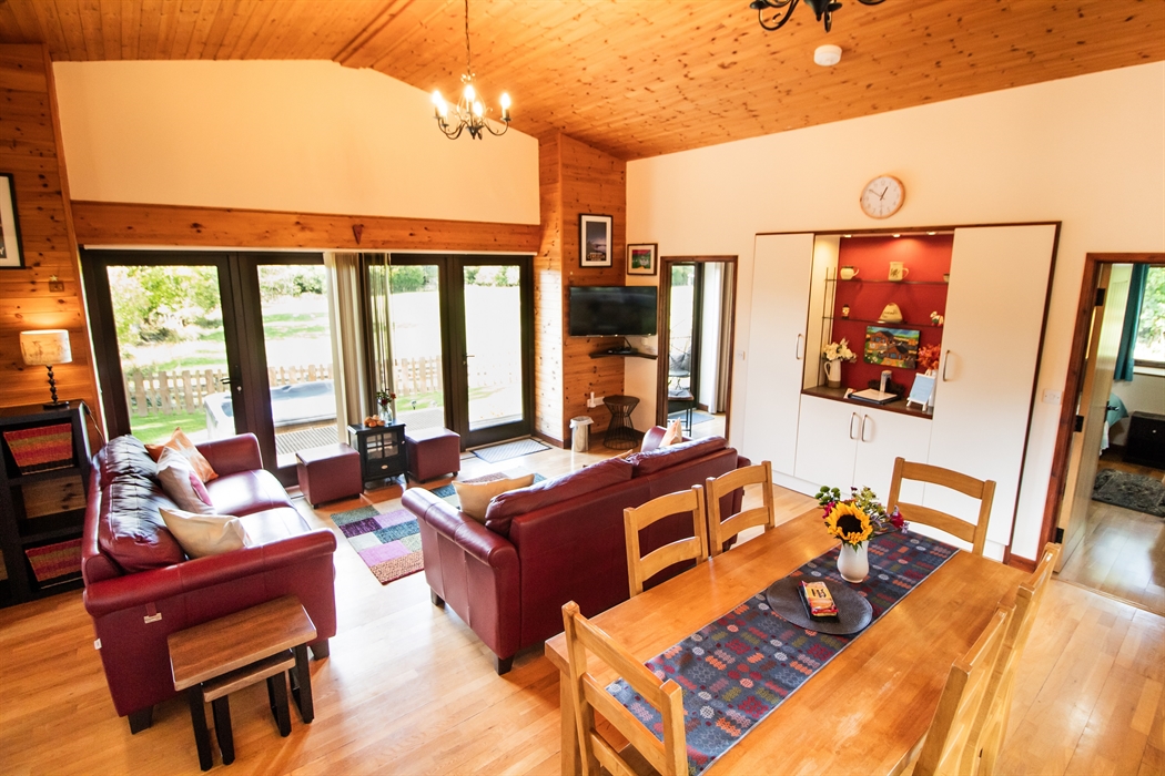 Lounge area with smart TV and a view across the countryside.