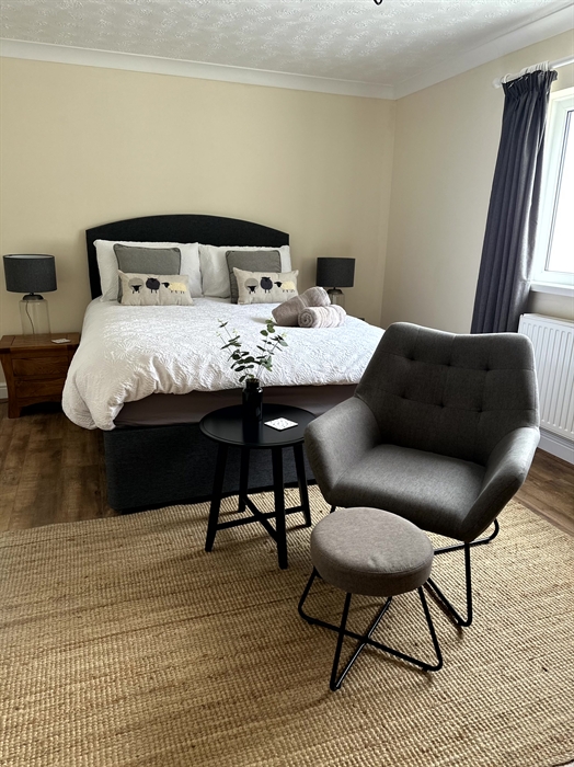 Master bedroom featuring ensuite. Ensuite contains wc, basic, toilet and shower.