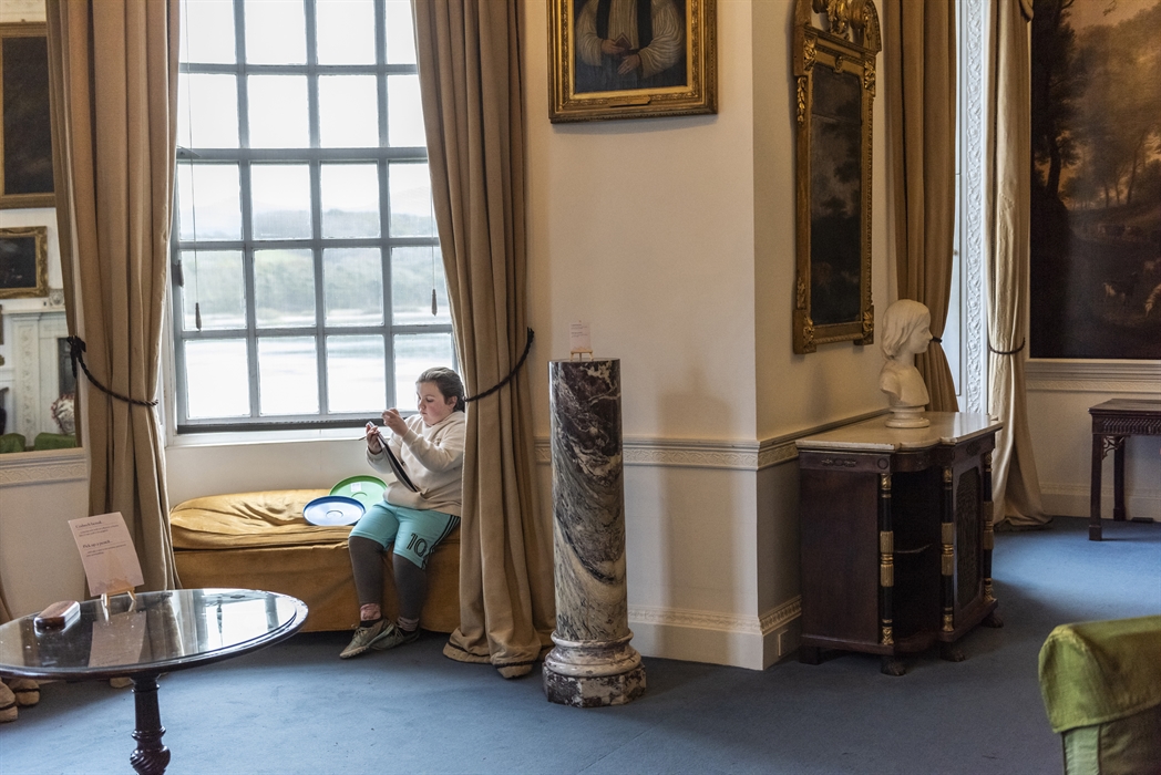 Children enjoy drawing inside the house at Plas Newydd, Anglesey