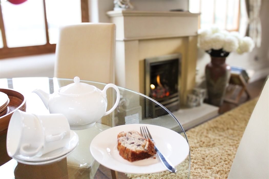 Home made cake from the welcome tray with white china