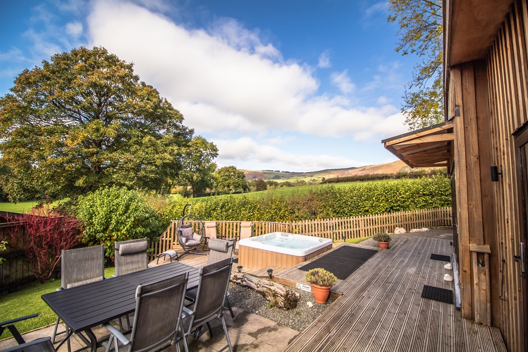 Relax on your private patio overlooking the fields and the countryside views.