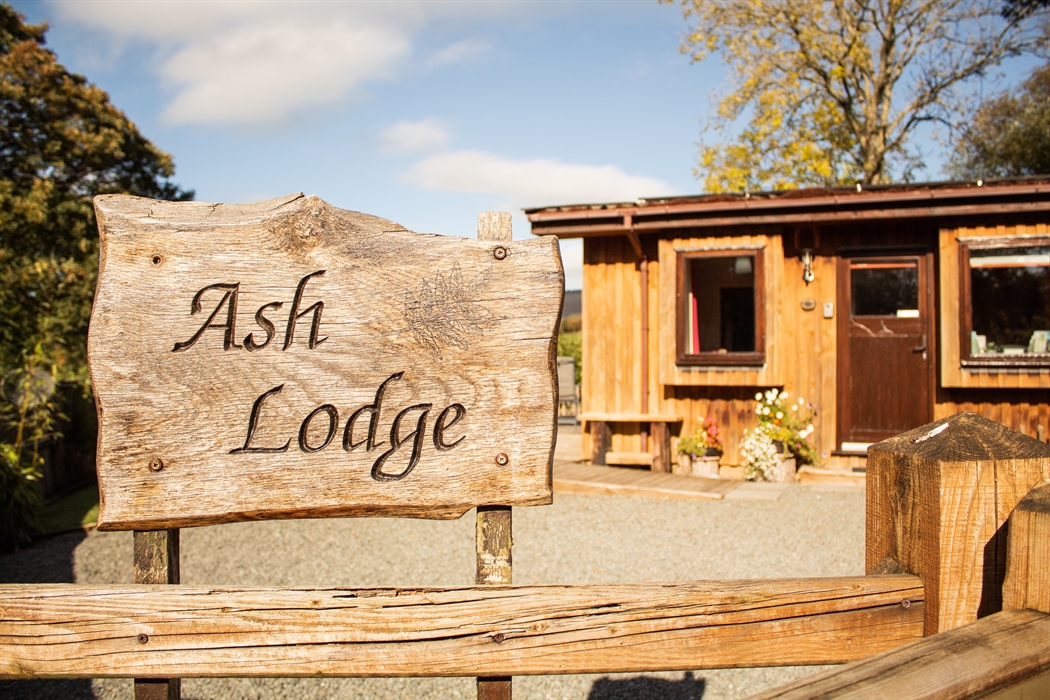Ash Lodge entrance with a fenced and secure parking up to 3 cars.