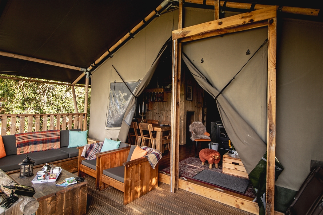 A luxury glamping lodge with private outdoor area fpr relaxing.