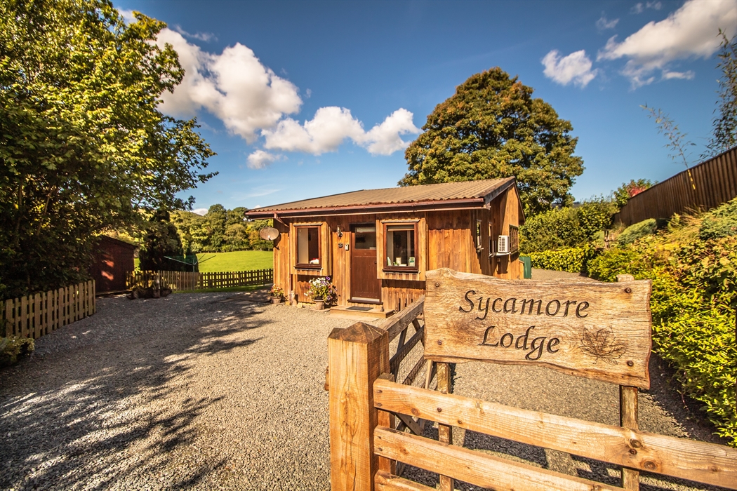 Sycamore Lodge entrance with parking up to 3 cars.