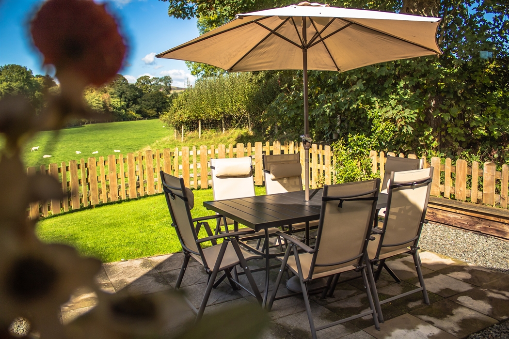 Relax on your private patio overlooking the fields and the countryside views.