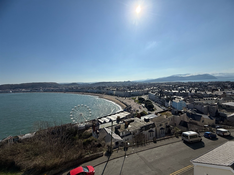 Coastal resort with mountains in background
