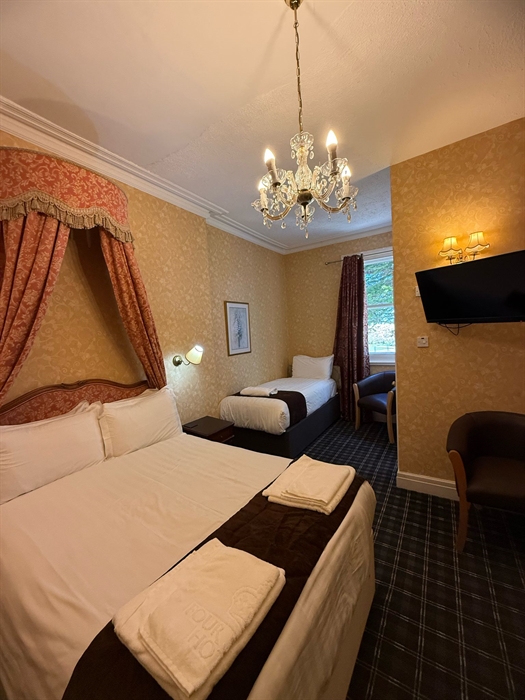 Hotel bedroom with double and single bed