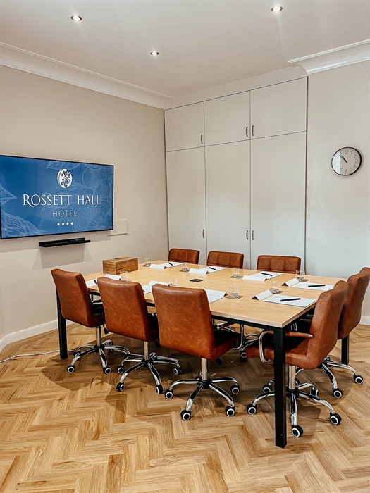 Boardroom-style conference setup at Rossett Hall Hotel.