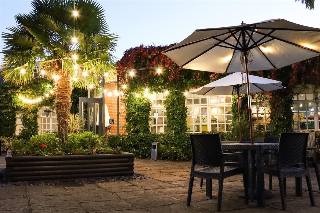 Oscar’s outside terrace at Rossett Hall Hotel in the evening light.