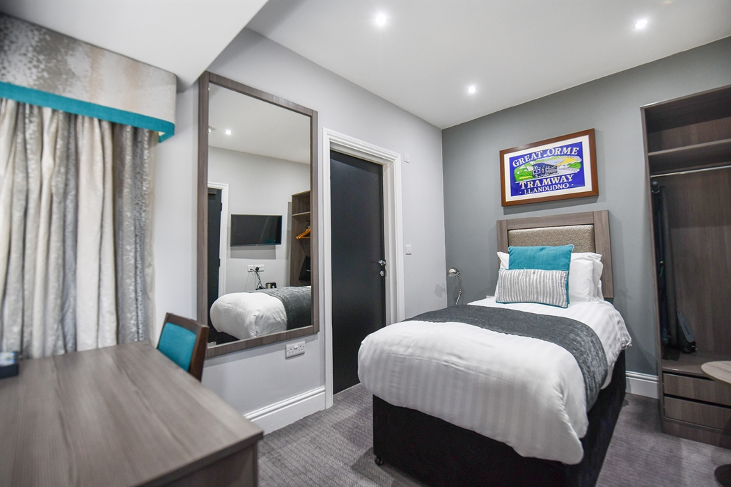 Standard single bedroom at The Belmont Hotel Llandudno with comfortable bedding and modern décor