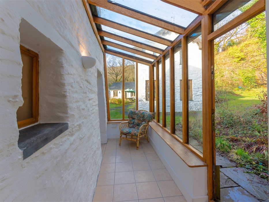Conservatory with outdoor area views through glass