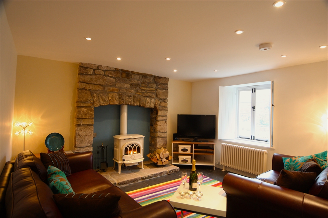 Tintern Abbey Cottage cosy sitting room  with woodburner and Tintern Abbey view