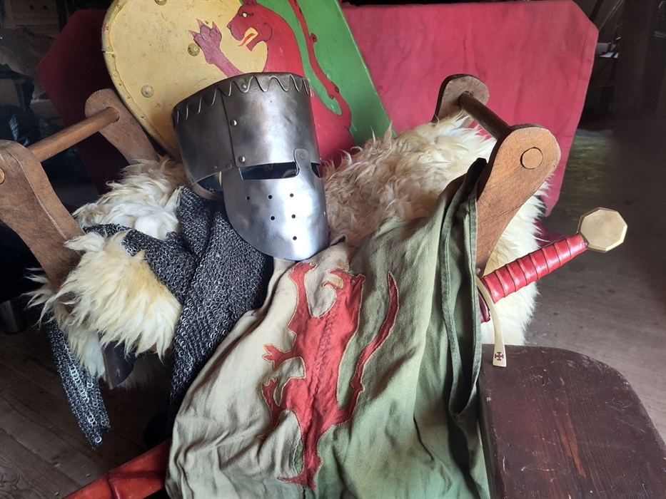 Knight's armour and clothes on display table