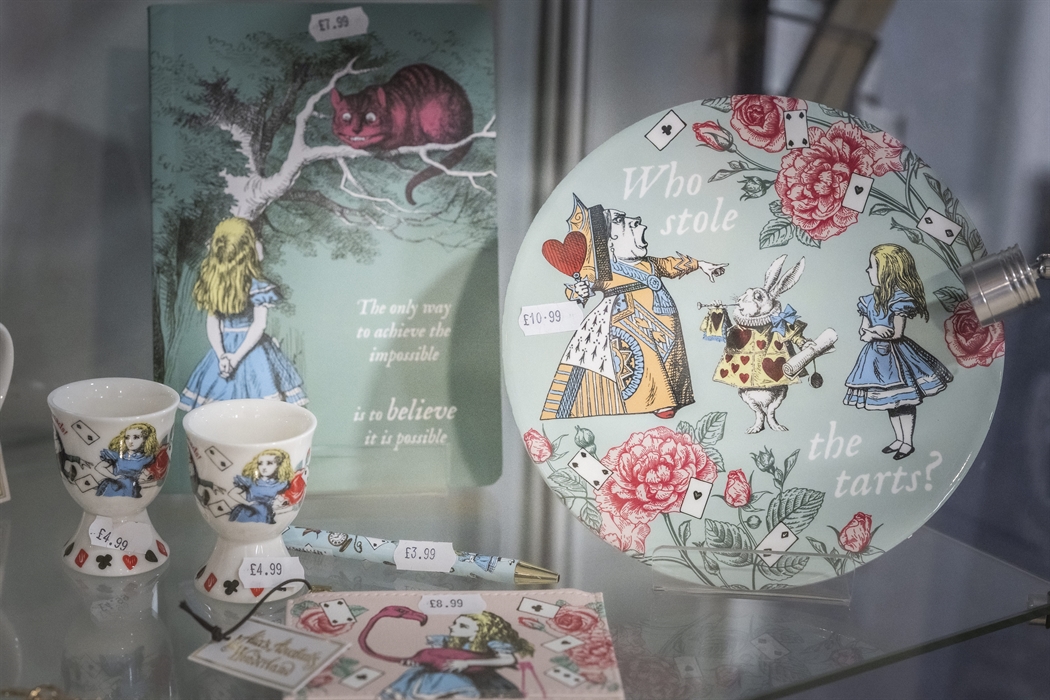 Alice in Wonderland themed souvenirs including plates, egg cups, notebooks and keepsakes inspired by Llandudno’s connection to Alice.
