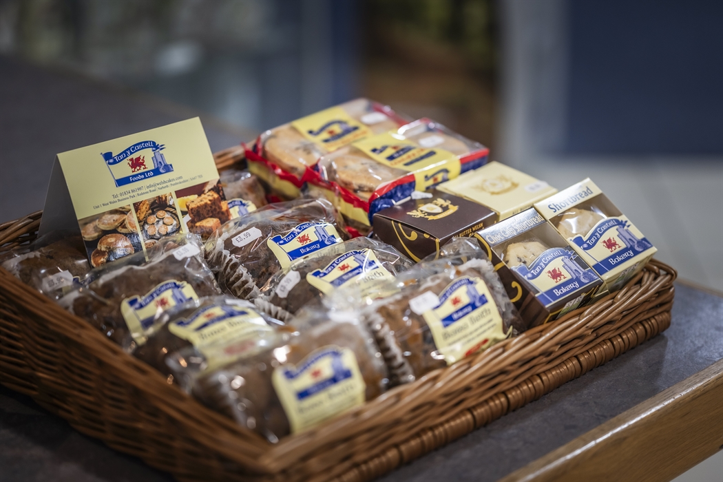 Basket display of traditional Welsh cakes, bara brith and shortbread from a local Welsh bakery.