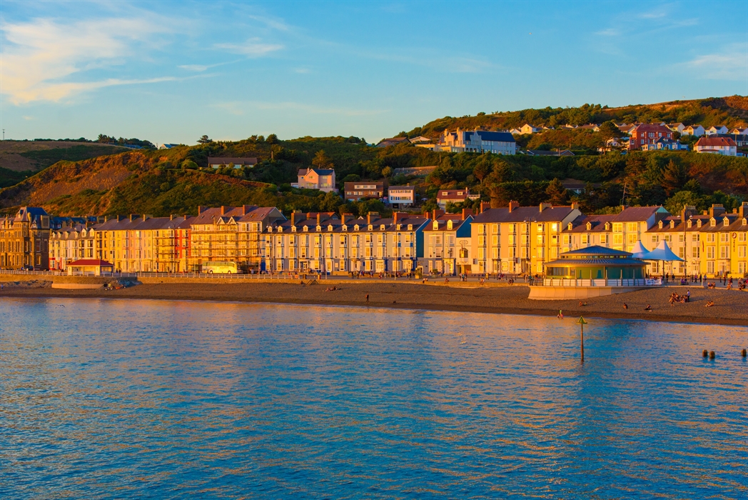 Hotel exterior overlooking the seafront at sunset