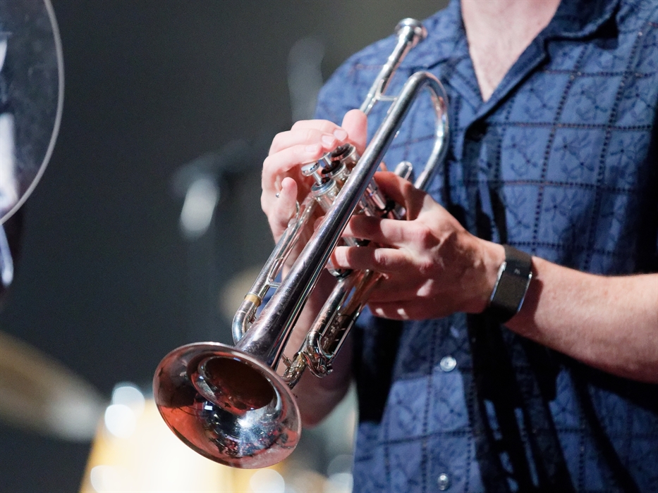 Close up of a man holiding a trumpet at the Swansea Jazz Festival