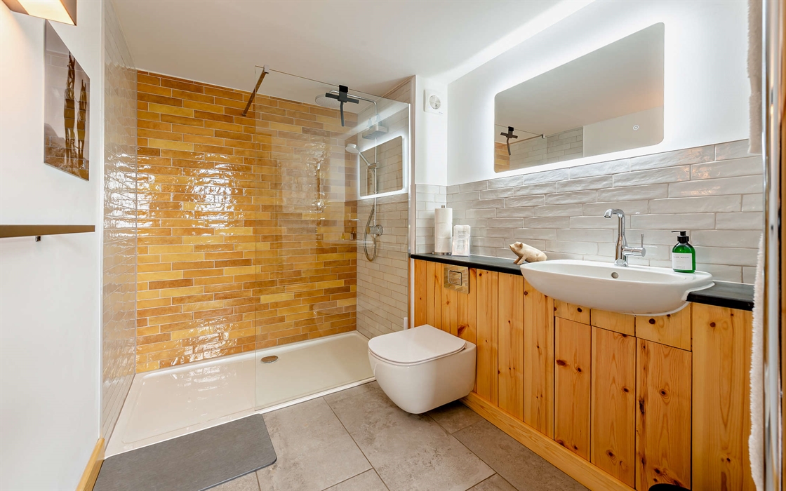 The shower room for your eco stay has a generous walk-in deluge shower and glass screen