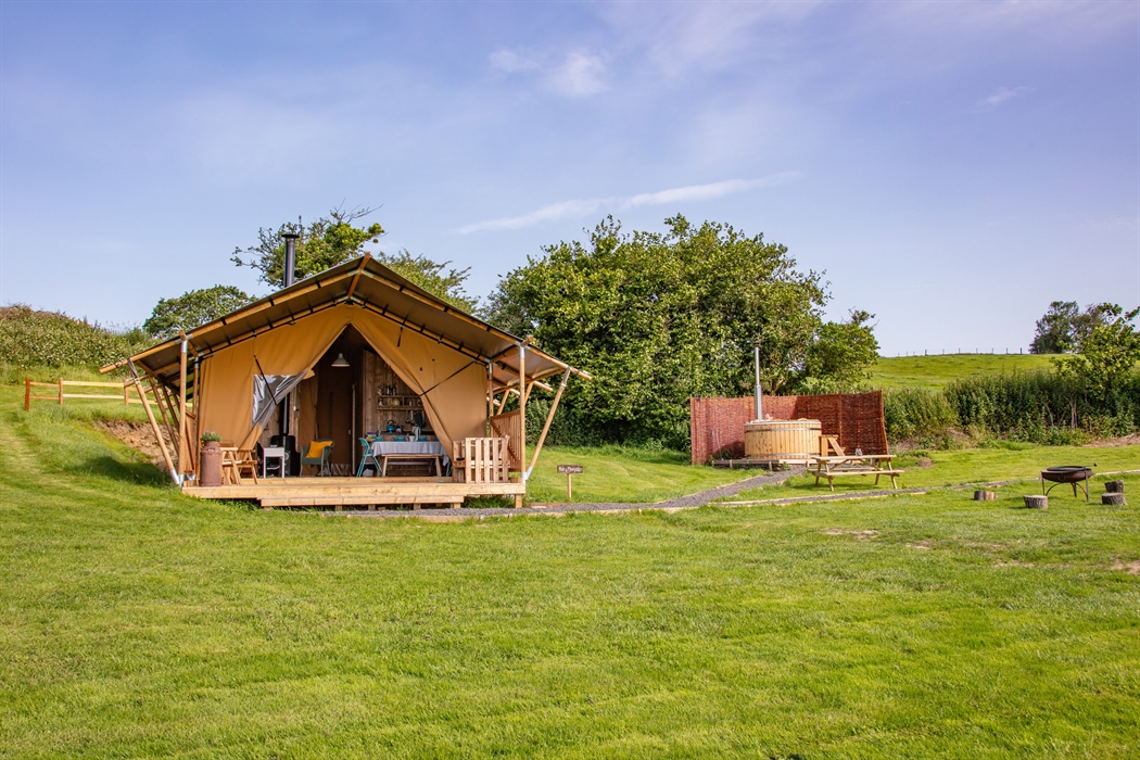 exterior of safari tent and hot tub