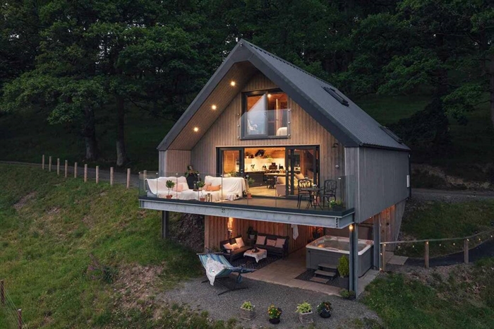 Wake up to a view of a lush Welsh valley.