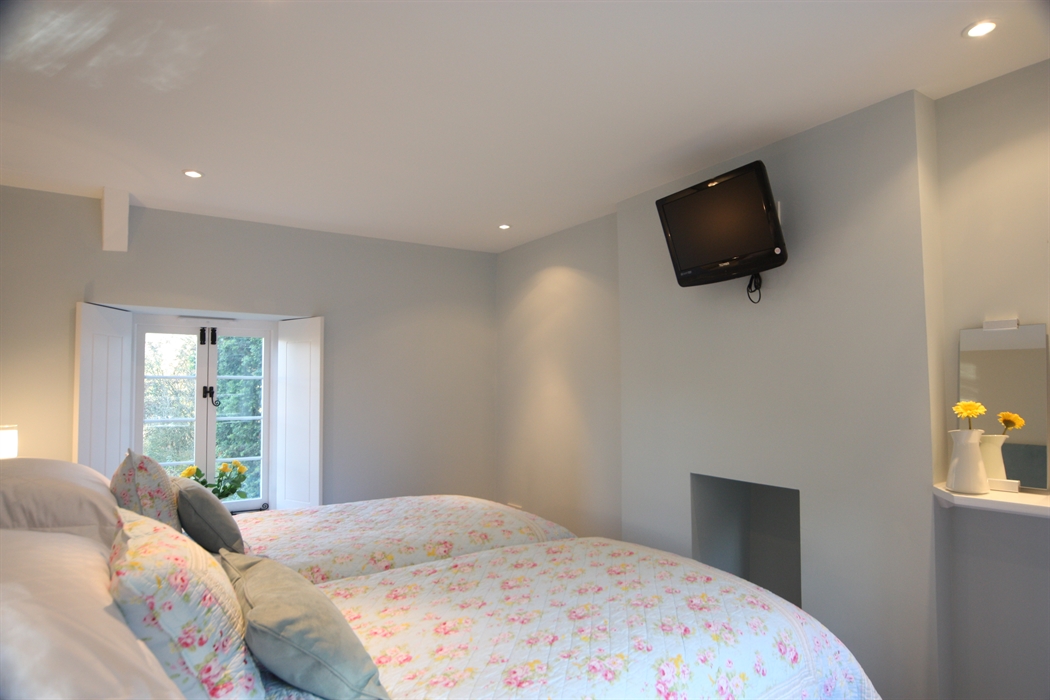 One of the bedrooms here set up as a pair of twin beds