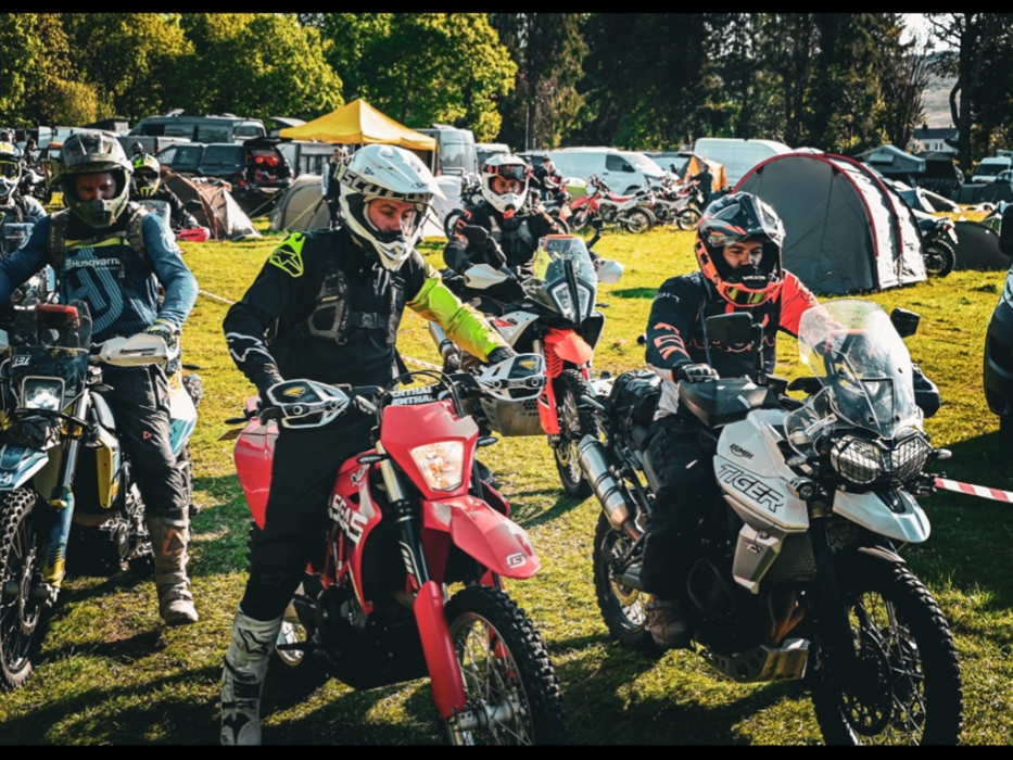 Riders planning a route at base camp