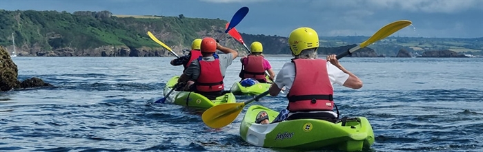 Kayakers on a guided tour of the Tenby coastline